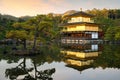 View of Kinkakuji the famous Golden Pavilion with Japanese garden and pond with dramatic evening sky in autumn season at Kyoto, Royalty Free Stock Photo