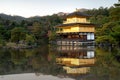 View of Kinkakuji the famous Golden Pavilion with Japanese garden and pond with dramatic evening sky in autumn season at Kyoto, Royalty Free Stock Photo