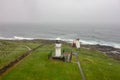 The view from Kinnaird Head Lighthouse, Fraserburgh, Scotland in heavy rain with a fog and dramatic waves on the sea