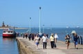 People on Knott End ferry slip with Wyre Rose Royalty Free Stock Photo