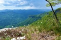 View of Kolpa valley in Slovenia and forest covered slopes above