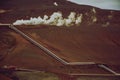 View of Krafla geothermal power plant, near Krafla Viti Volcano, Northeastern Iceland, in summer, with some grain