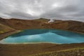 View at Krafla volcanic crater and Viti lake in northern Iceland, vapor of geothermal power plant unit is at background Royalty Free Stock Photo