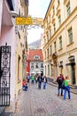 View from Kramu Street to the old buildings with one of the oldest restaurant 1221 on the Jauniela street, Old Town, Riga Royalty Free Stock Photo