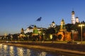 View of the Kremlin embankment, the towers of the Kremlin, the Grand Kremlin Palace, Ivan the Great Bell Tower in the late evening Royalty Free Stock Photo