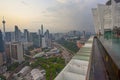 View of Kuala Lumpur skyline at sunrise from luxury apartment roof top swimming pool