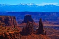 View of La Sal Mountains from Canyonlands with Washer Woman Arch