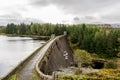 A view of Laggan Dam with 6 pipes to release water from the loch to river Spean, Scotland