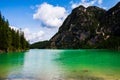 View of Lago di Braies between the dolomiti mountains, a cloudy summer day Royalty Free Stock Photo