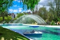 View of the lagoon with a fountain and a catamaran with pedals water bicycle, in the public park of La Carolina in the north of