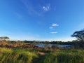 The view of the lake in the afternoon surrounded by trees adds to the beauty of your vacation