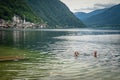 View on lake in austrian town hallstatt during tourist season in summer