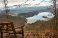 View of Lake Bled in Slovenia from the viewpoint on Mount Velika Osojnica next to a wooden bench on the mountain. Picture taken in Royalty Free Stock Photo