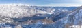 View of the Lake Bohinj and the surrounding mountains in winter.