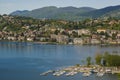 View of the lake and the city of Lugano on a sunny day. Mountain landscape in the city of Lugano, Switzerland. Royalty Free Stock Photo