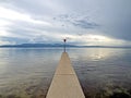 View of Lake Constance and a deserted pier at dusk Royalty Free Stock Photo