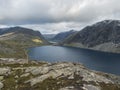 View of the Lake Djupvatnet from raod to mountain Dalsnibba plateaua. Norway, early autumn, cloudy day. Travel Holiday Royalty Free Stock Photo