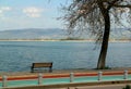 View of Lake Iznik with its embankment and a blue sky with clouds in the background in the city of Iznik