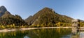 View of Lake Jasna with forest and mountain landscape in beautiful autumn colors and an observation tower in the foreground Royalty Free Stock Photo