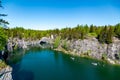 a view of the lake in the marble canyon where pleasure boats float. Ruskeala, Karelia. Royalty Free Stock Photo