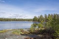 View of Lake Meiko area in spring, rocks, pine trees and lake