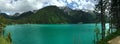 View of the lake and mountain peaks and rocks of the Dolomites in Italy in the Auronzo di Cadore in Tyrol under a overcast