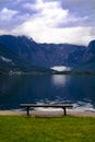 View of the lake and mountains from the wooden bench in Austria.