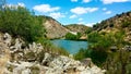 view of a lake between some mountains, on a spring day Royalty Free Stock Photo