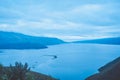 View from the top of Lake Toba hill with views of the hills and beautiful blue lake water Royalty Free Stock Photo