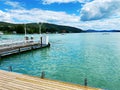 View of Lake WÃ¶rthersee in Velden from the jetty. Promenade along the WÃ¶rthersee Lake. Royalty Free Stock Photo