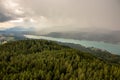 View from Lake WÃÂ¶rther See in the Austrian Alps overlooking a beginning storm with dark clouds and rain