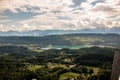 View from Lake WÃÂ¶rther See in the Austrian Alps overlooking a beginning storm with dark clouds and rain