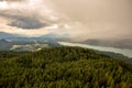 View from Lake WÃÂ¶rther See in the Austrian Alps overlooking a beginning storm with dark clouds and rain