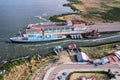 View of a lakeside port with ships in the process of loading Royalty Free Stock Photo