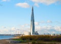 View of the Lakhta Center under construction and the park of the 300th anniversary of St. Petersburg on a solar autumn Royalty Free Stock Photo