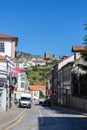 View at the Lamego city downtown street and exterior facade tower at Castle of Lamego, an iconic monument building on the top at