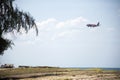 View landscape and airplane boeing flying pass Banton Beach and village go to landing on runway at Narathiwat airport at on August