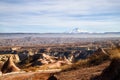 View of the landscape in the Cappadocia valley with strange yellow mountains, rocks and hills and blue sky