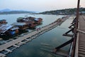 View landscape floating village and rafts hotel resort with Saphan Mon or Uttamanusorn bridge for thai people foreign travelrs