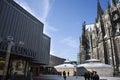 View landscape modern buildings and German people and foreign travelers walking go to Cologne Cathedral or Hohe Domkirche St. Royalty Free Stock Photo