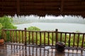 View landscape of mountain and lake while raining storm in antique old wooden retro house home or vintage wood cottage in garden Royalty Free Stock Photo