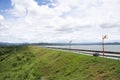 View landscape mountain and street road on crest reservoir of Krasiao earthen dam at Dan Chang district for thai people travelers Royalty Free Stock Photo