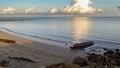 View of landscape nature sunrise scenery of seacoast and fishing boat at Batu Manikar,Labuan,Malaysia. Royalty Free Stock Photo