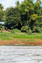 View of the landscape of the river Nam Khan, Luang Prabang, Laos. Copy space for text. Vertical. Royalty Free Stock Photo