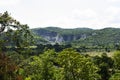 View landscape and sculpture carving big buddha carving on stone cliff mountain Wat Khao Tham Thiam for thai people travelers