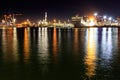 View of Lanterna (lighthouse) in the old port of city of Genoa at night, Italy