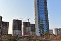 View of a large construction site with buildings under construction and multi-storey residential homes.Tower cranes in action on Royalty Free Stock Photo