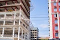 View of a large construction site with buildings under construction and multi-storey residential homes.Tower cranes in Royalty Free Stock Photo