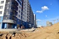 View of a large construction site with buildings under construction and multi-storey residential homes.Tower cranes in action on Royalty Free Stock Photo