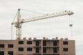 View of a large construction site with buildings under construction and multi-storey residential homes. Tower cranes in Royalty Free Stock Photo